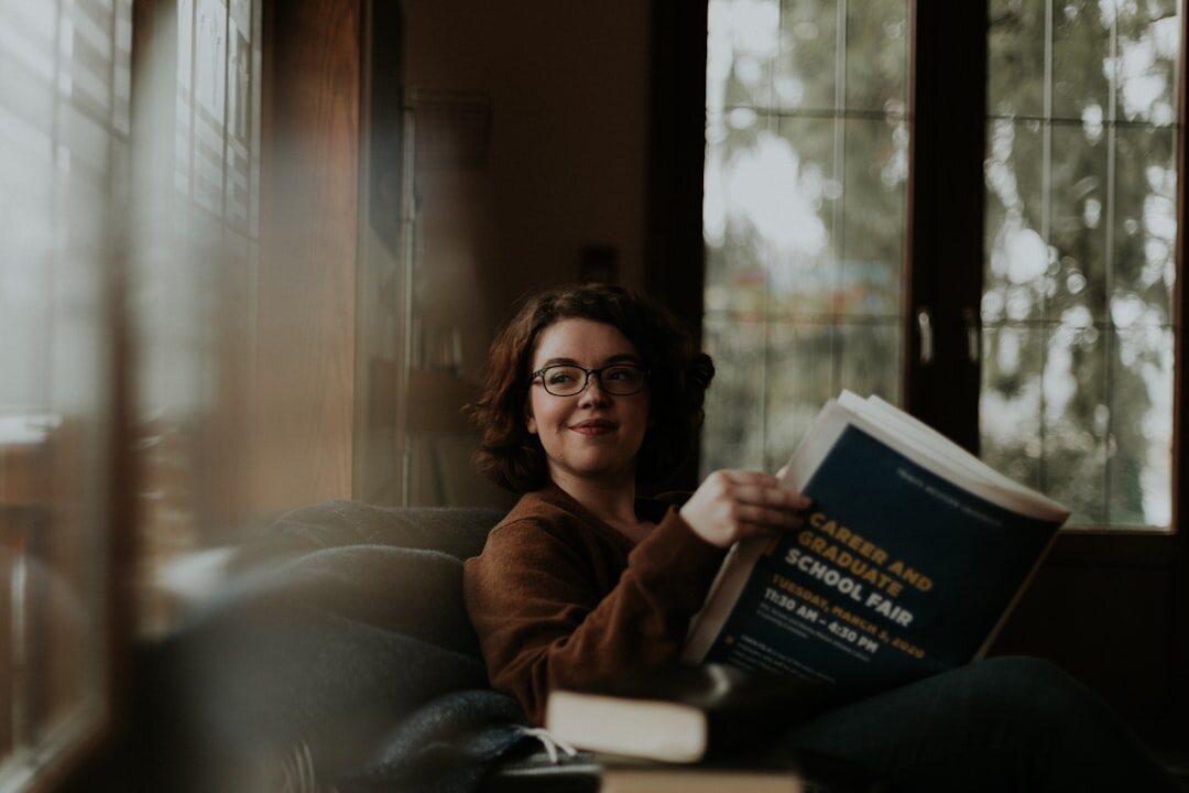 person reading self help book