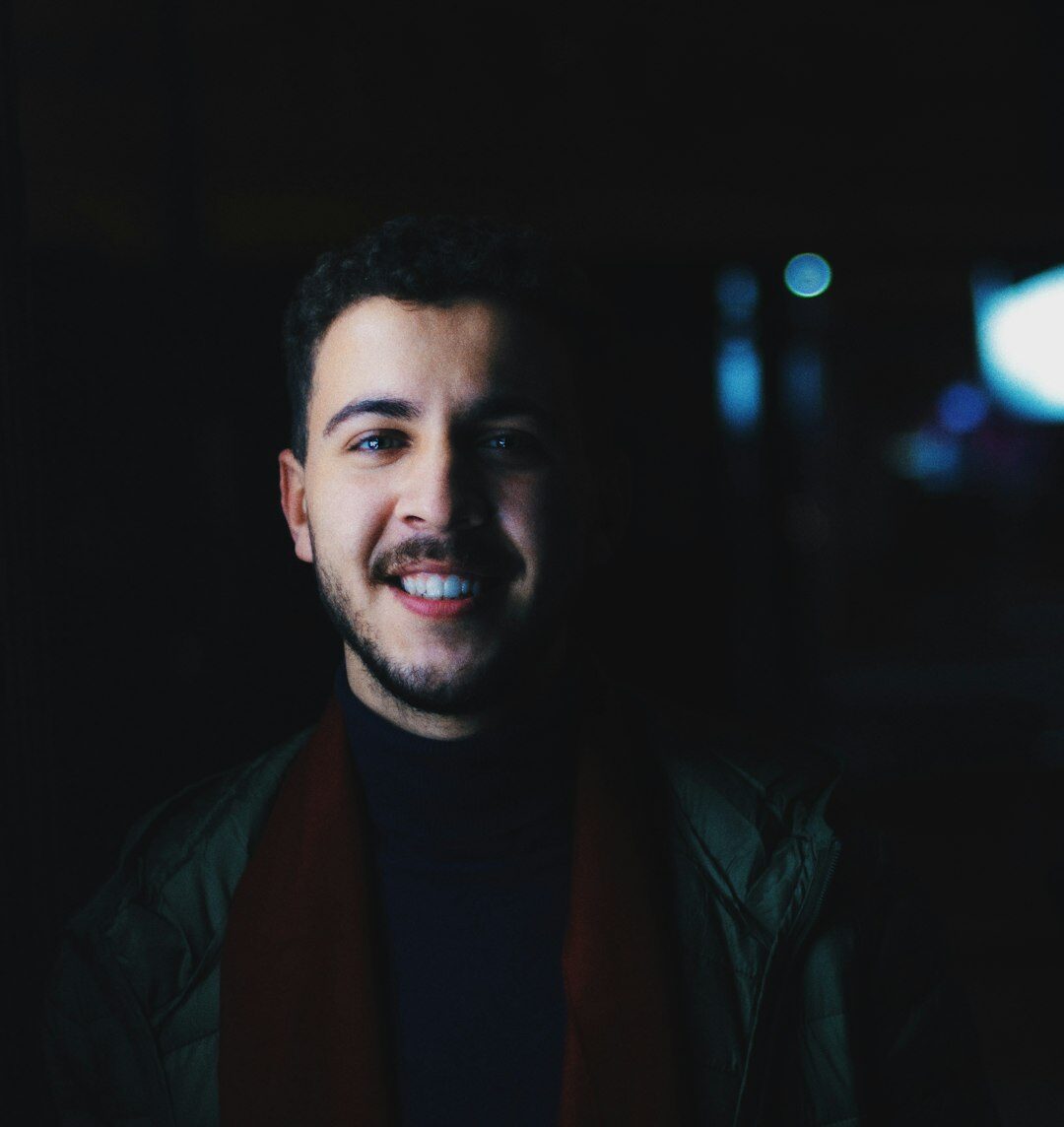 Portrait of a brazilian man smiling warmly in a casual sweater